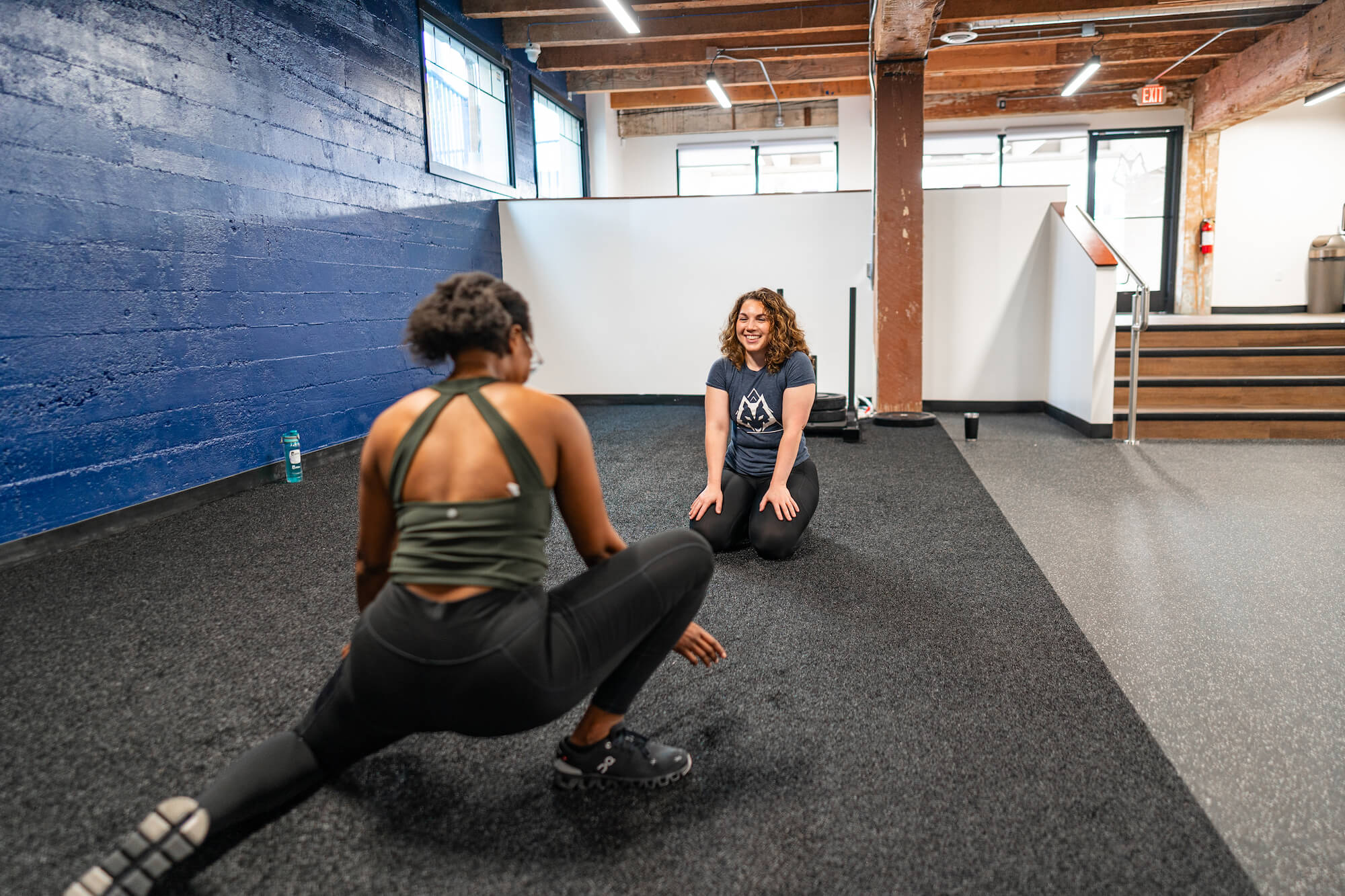 Our sports physical therapist in a treatment session - mobility of hip and ankle for our athlete